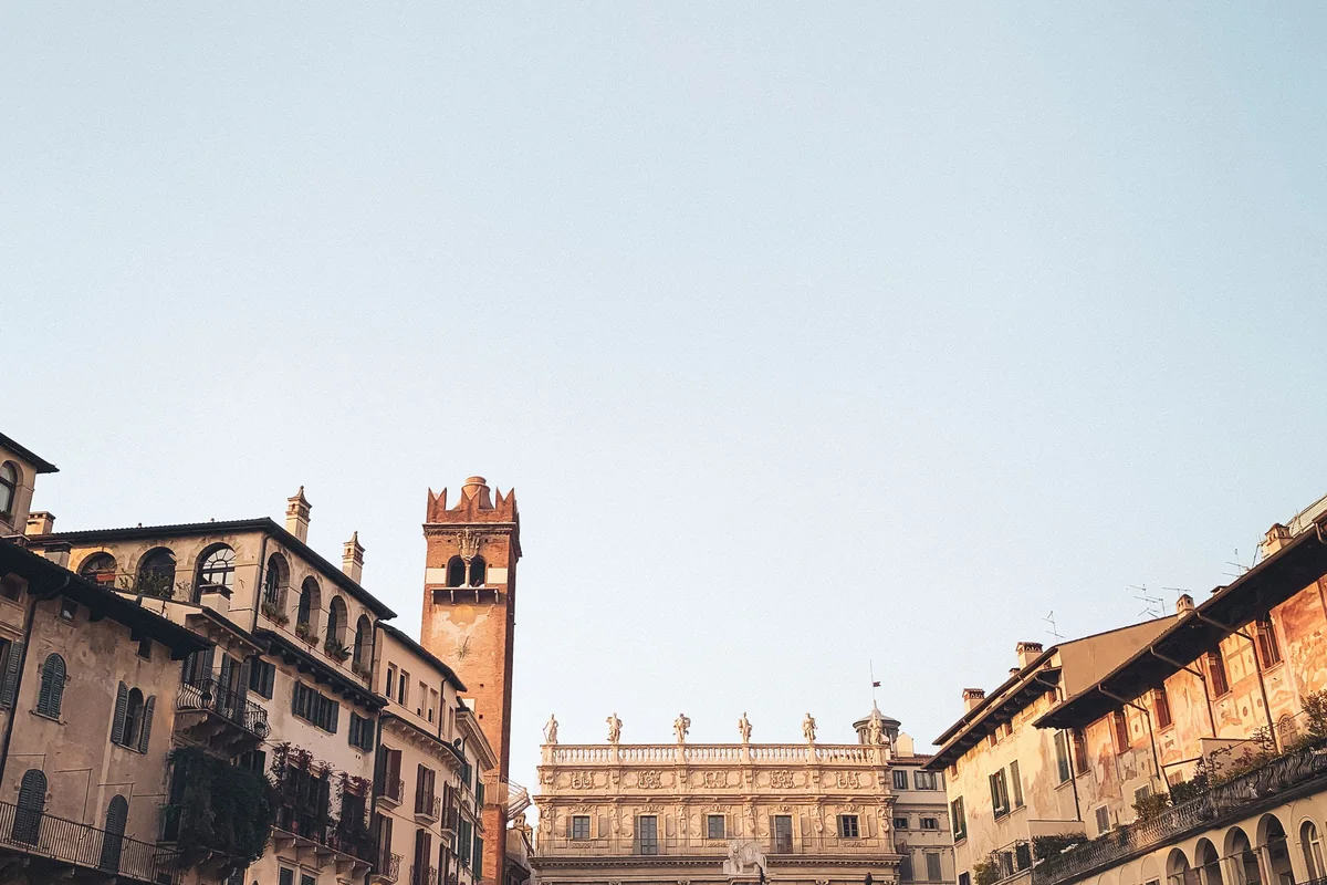 Piazza delle Erbe in Verona with its market stalls and medieval tower
